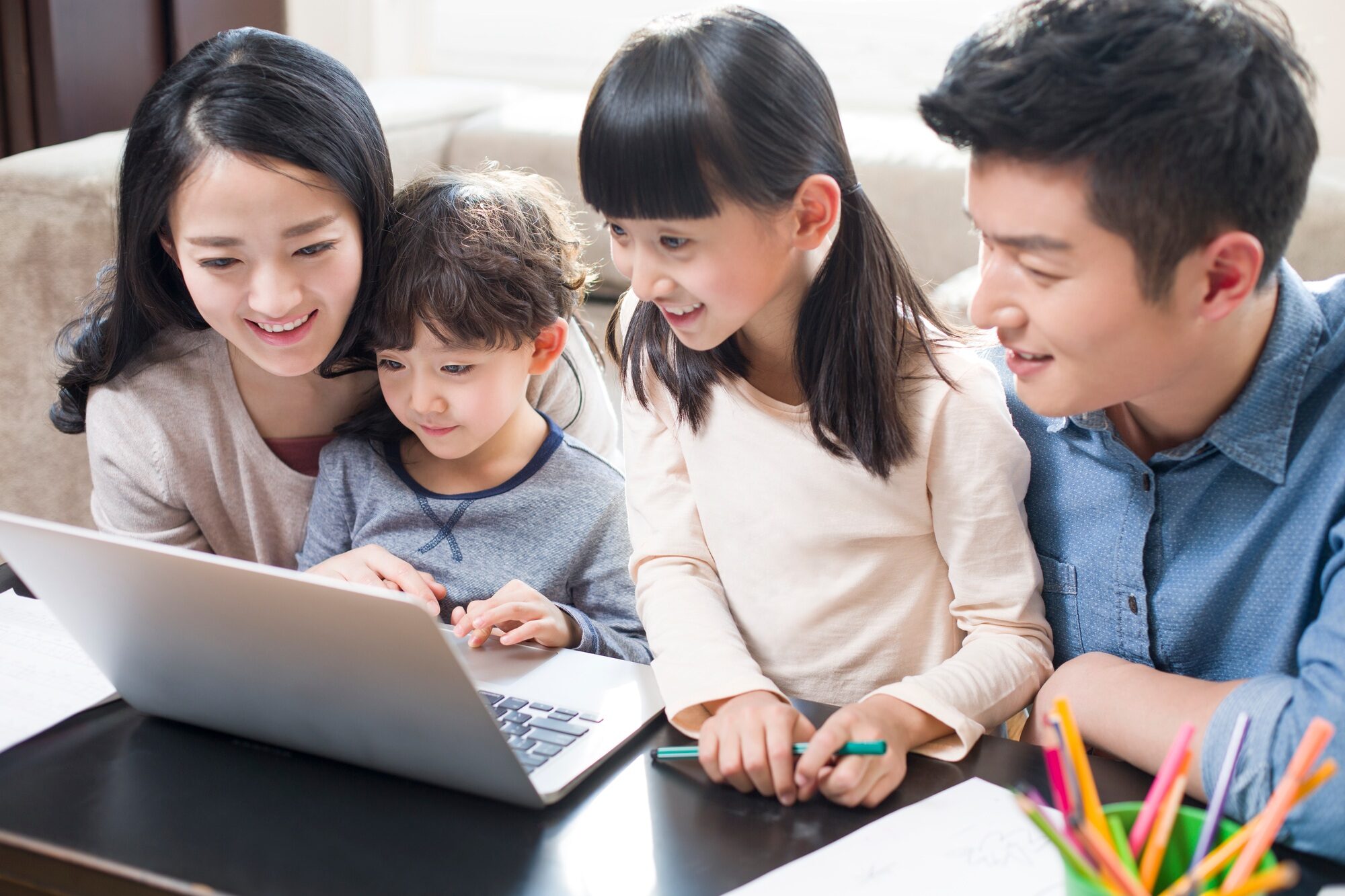 Young family using laptop
